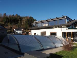 a glass house on top of a building at Ferienwohnung Böhler in Doren