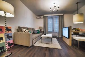 Televízia a/alebo spoločenská miestnosť v ubytovaní CASA V BENCUN Luxury Apartments