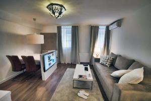 TV a/nebo společenská místnost v ubytování CASA V BENCUN Luxury Apartments