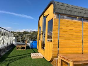 a tiny house with a table and a bench at MARSOL C,S,Beach hotel - Vacation STAY 50798v in Chigasaki