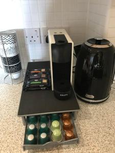 a coffeemaker sitting on a counter next to a coffee maker at Central Retford 2 bed quiet apartment with parking in Retford
