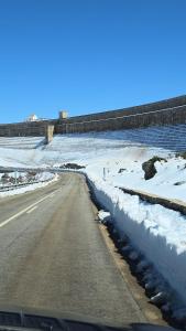 a road with snow on the side of the road at Albergaria Senhora do Espinheiro in Seia