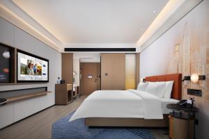 เตียงในห้องที่ Hampton by Hilton Shenzhen Futian Huaqiangbei