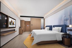 เตียงในห้องที่ Hampton by Hilton Shenzhen Futian Huaqiangbei