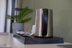 a speaker sitting on top of a counter at Suite Inn Catania in Catania