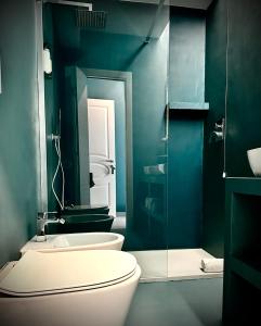 a bathroom with a toilet and a sink at Trastevere House in Rome