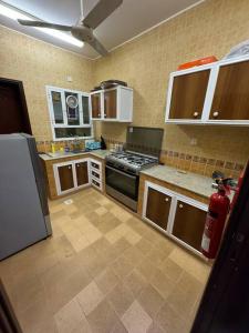 a kitchen with a fire hydrant in the middle of it at City center 1 bedroom apartment in Muscat