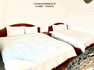 Postelja oz. postelje v sobi nastanitve Nanwan254 Homestay