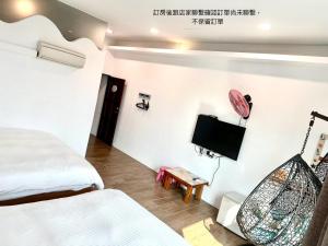 Postelja oz. postelje v sobi nastanitve Nanwan254 Homestay