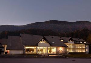 a large building with a lot of windows at Apartment Silver Deer, Kranjska Gora in Kranjska Gora