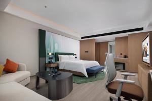 เตียงในห้องที่ Hampton by Hilton Shenzhen Futian Huaqiangbei