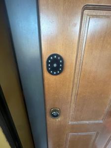 a wooden door with a door knocker on it at B&B le palme mini appartamento mansardato in Bentivoglio