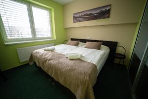 Rúm í herbergi á Garni hotel Svitavy