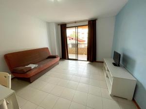 Telewizja i/lub zestaw kina domowego w obiekcie Apartamentos Bernat 3000