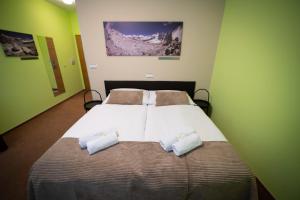 Rúm í herbergi á Garni hotel Svitavy