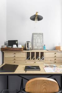 a wooden desk with a lamp on top of it at Le Petit Rocher in Vienne