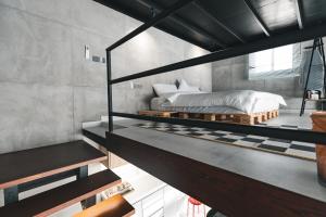a bedroom with a bed on top of a counter at NSMA - The Loft experience in Riyadh