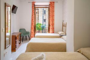 Postel nebo postele na pokoji v ubytování Hotel Manzanito