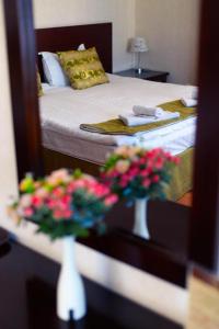 Postelja oz. postelje v sobi nastanitve Отель San Marino