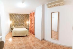 Postel nebo postele na pokoji v ubytování Hotel Manzanito