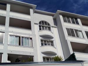 a white building with balconies on the side of it at Coccolo Apartment Montfleury in Cannes