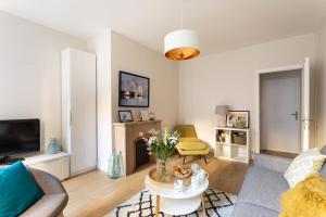 TV a/nebo společenská místnost v ubytování Chez Léon - Appt à 500m des plages + 5 fotografií