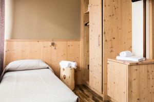 Postel nebo postele na pokoji v ubytování Locanda Montegrappa