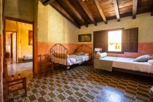 a bedroom with two beds in a room at Casa Museo RAKKANA - En el Centro de Requena in Requena +45 photos