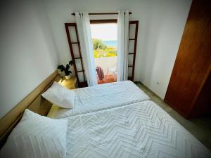 Postel nebo postele na pokoji v ubytování Mojacar Casa El Cantal Playa con vistas la Mar