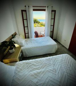 Postel nebo postele na pokoji v ubytování Mojacar Casa El Cantal Playa con vistas la Mar