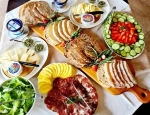 a table topped with lots of different types of food at Silver Hill Lodge in Kamberg Valley