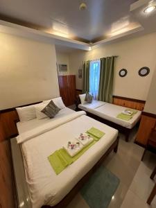 Postel nebo postele na pokoji v ubytování Desert Rose Beach Hotel
