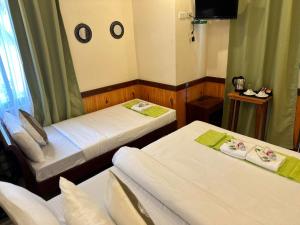 Postel nebo postele na pokoji v ubytování Desert Rose Beach Hotel