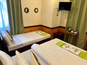 Postel nebo postele na pokoji v ubytování Desert Rose Beach Hotel