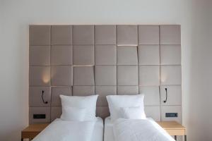 Llit o llits en una habitació de Klinglhuber Suites