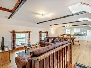 a living room with a couch and a table at 3 Bed in Wolsingham 94198 in Wolsingham