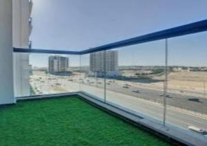 a room with a large window with a view of a highway at Key View - Glamz Residence Tower 2 in Dubai