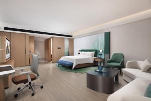 เตียงในห้องที่ Hampton by Hilton Shenzhen Futian Huaqiangbei