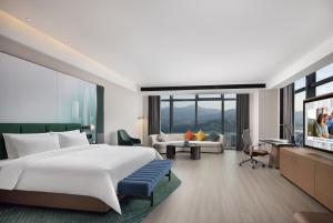 เตียงในห้องที่ Hampton by Hilton Shenzhen Futian Huaqiangbei