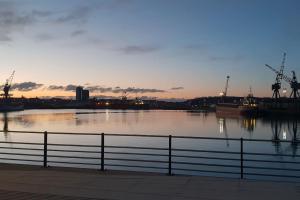 a view of a body of water at sunset at Home from Home in Brompton