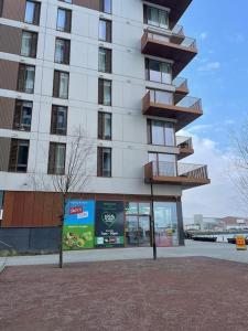 a tall building with balconies on the side of it at Home from Home in Brompton