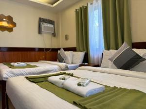 Postel nebo postele na pokoji v ubytování Desert Rose Beach Hotel