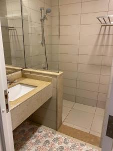 a bathroom with a sink and a shower at Almaza Bay, 2 bd ground floor (Prime location) in Marsa Matruh