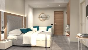 Postel nebo postele na pokoji v ubytování Hotel Miramare Chioggia Sottomarina + 24 fotografií
