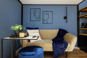 a living room with a couch and a table at AK7 Boutique Suites in Budapest