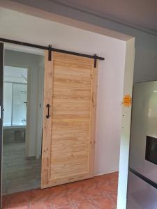 a wooden door in a room with a hallway at San Lameer Villa 3103 in Southbroom