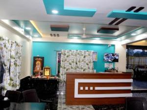 a blue room with a hair salon with a counter at Hotel Tarasrushti in Pune