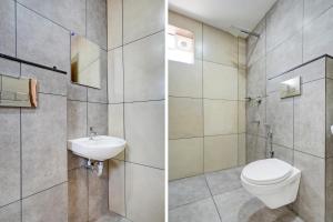 GYPSY HOTEL CUSAT في كوتشي: حمام مع مرحاض ومغسلة