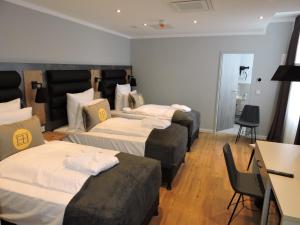Postel nebo postele na pokoji v ubytování DORMERO Hotel Bremen