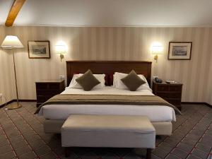 Letto o letti in una camera di Hotel De La Paix